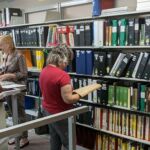 Open House Visitors Browsing Library Shelves - July 21, 2021